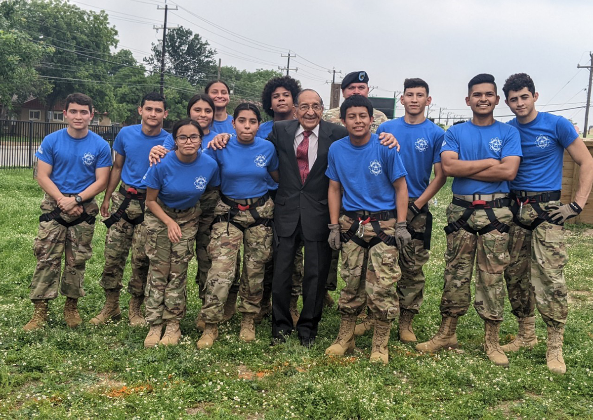 Mr. Aguirre with the VOK Raider Team and SSG Gonzalez, JROTC Cyber Instructor and Coach