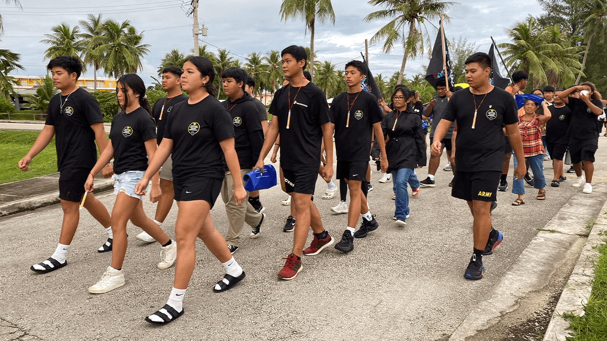 Stallion Battalion marching down as they lead Tinian’s 2023 Light Up The Night.
Credit: C/SGT Sofia Del Rosario