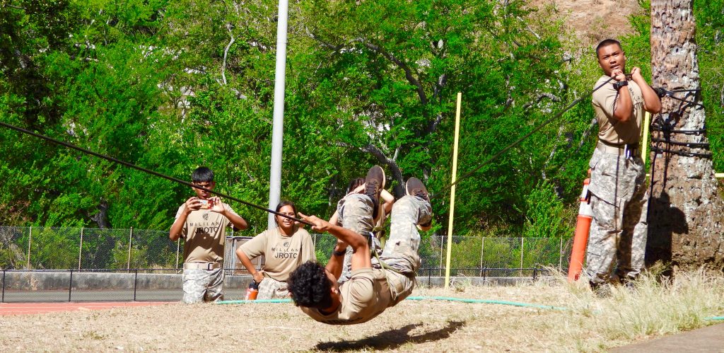 Mililani Operations Officer, S-3, C/Major Sopheaktra Va extends a fifty-foot rope-bridge upward, supporting Cadet Enzo Portuondo, inverted crossing