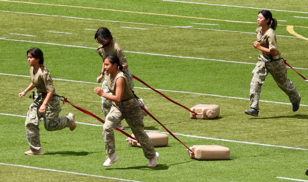 Girls Team during the obstacle course with a 5-gallon water jug attached to Aussie Seat. Front Left, Cadet C/MSG Nyzel Fagaragan, Front Right C/Captain Adriana Diago, Second on right, Cadet Sergeant Kayla Tran, Rear right Cadet Brynn Shimokawa.