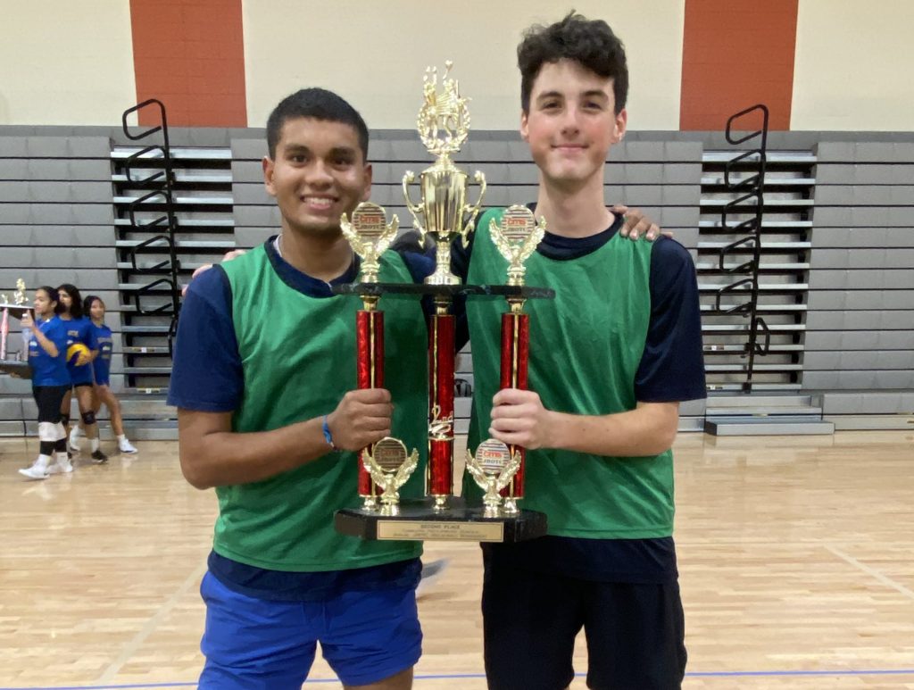 Cadet CSM Patel and Cadet Second Lieutenant Benson Holding the second place trophy