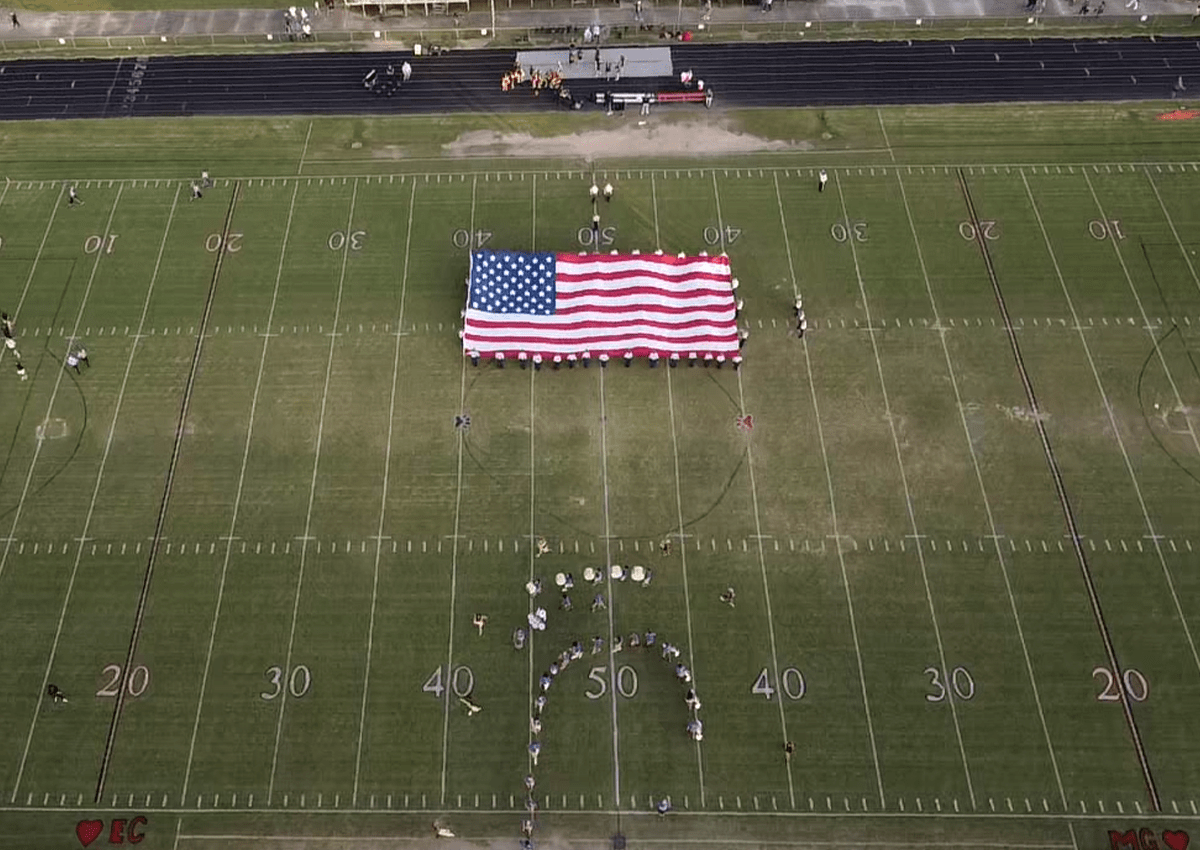 Photograph from aerial drone of American flag presentation