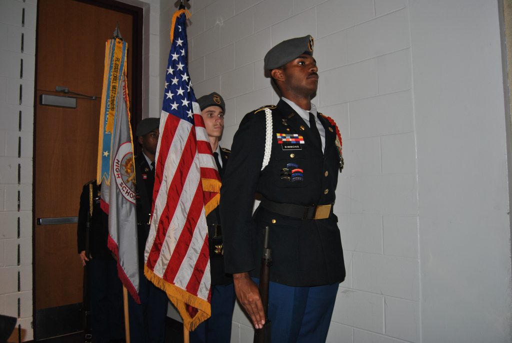 Eagle Battalion Color Guard posts the colors for the opening ceremony in the auditorium.