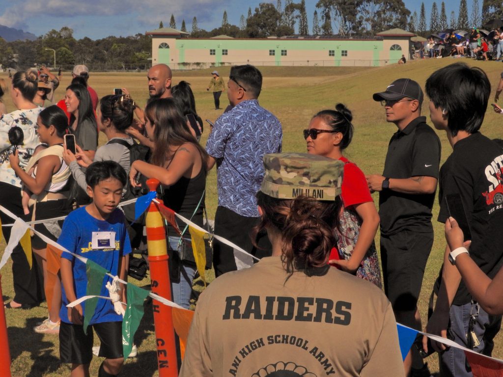 C/LTC Alexia Cramer, motivates along with students parents as they cross the finish line.