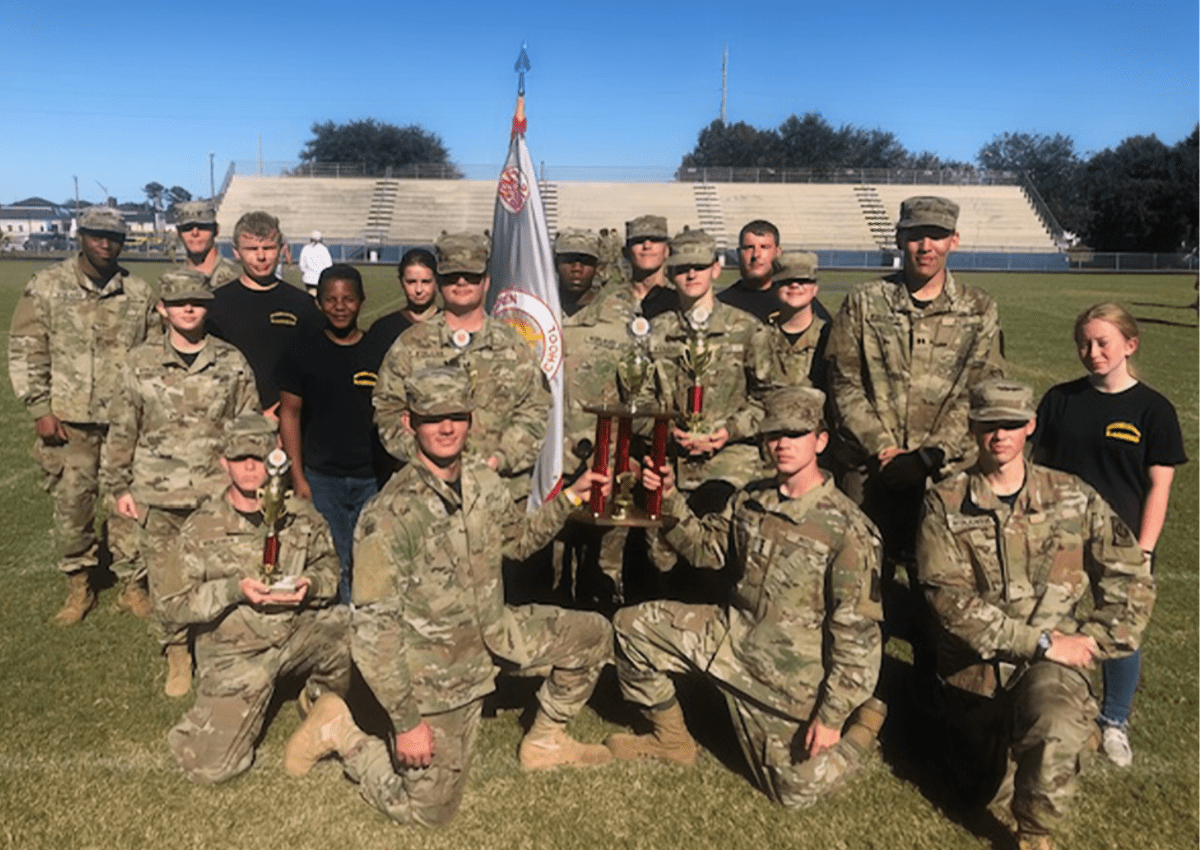 Photo shows the Raiders after the Competition with their first place trophies