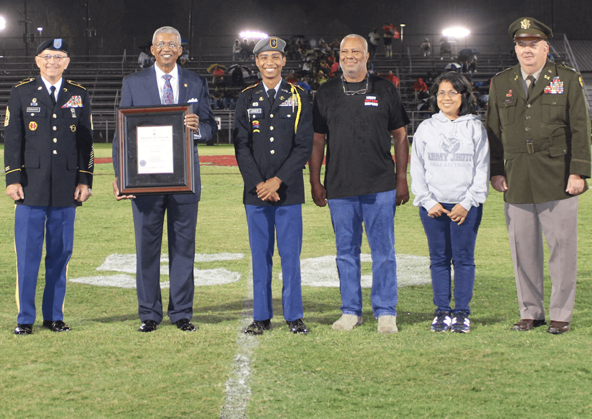 SGM (Ret) Kevin Donahoe, Senior Army Instructor for Florence High School, MG (Ret) Collins, Cadet Jones, LTC (Ret) Leon Jones, Father, Nimfa Jones, Mother, and LTC (Ret) Ellis Riser, Director of Army Instruction, Rankin County School District