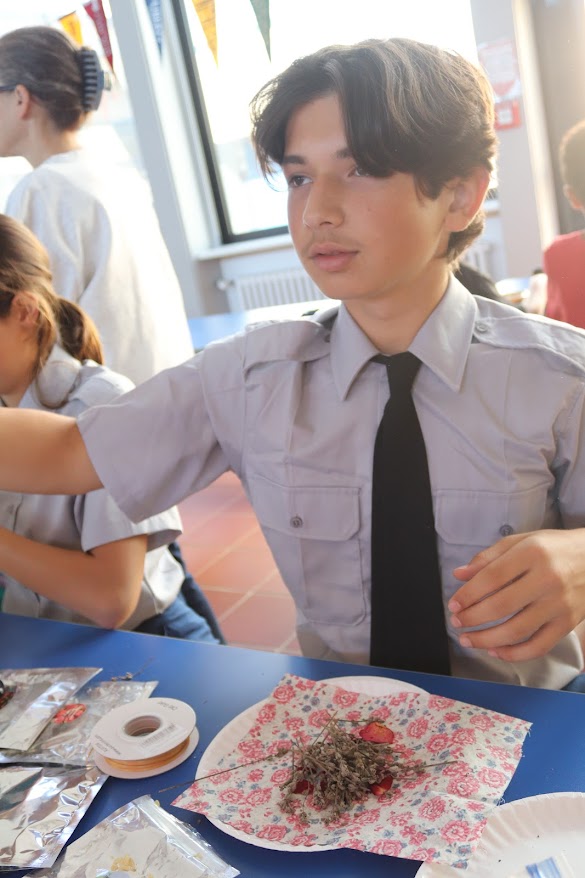 Cadet Aranha showing making colonial sweet bags.