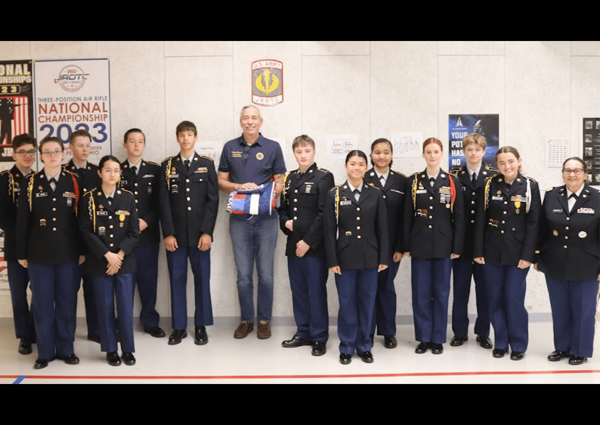 Cadets of the 9th JROTC Battalion pose with Mr. Mike Sherman with his Quilt of Valor.