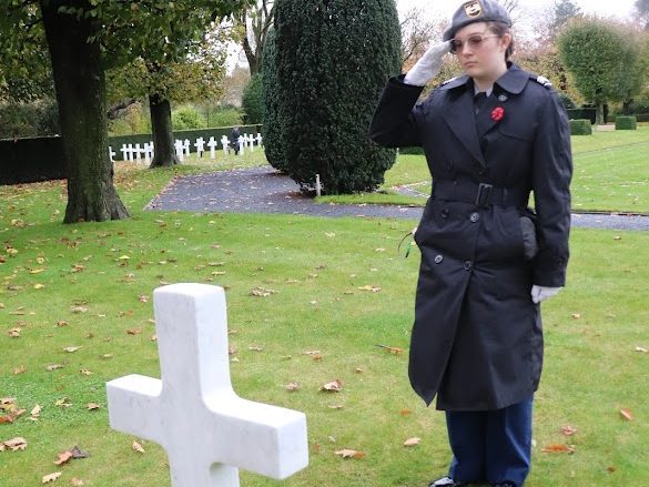 C/SGT Hailey Tudor pays respect at the grave of a fallen soldier at Flanders American Cemetery.