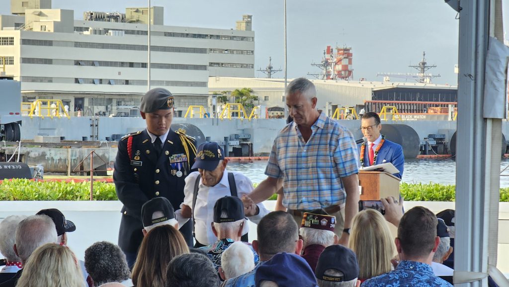 C/CPT Sean Sereno escorts Pearl Harbor survivor Harry Chandler.