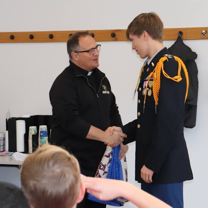 Cadet Duplessie thanks Father Paul for his service to our country.