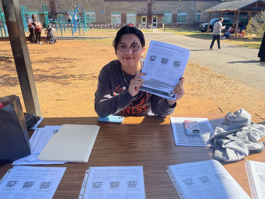 Cadet Maldanado advertises Purple Star Families at Reedy Creek Elementary Fall Festival.