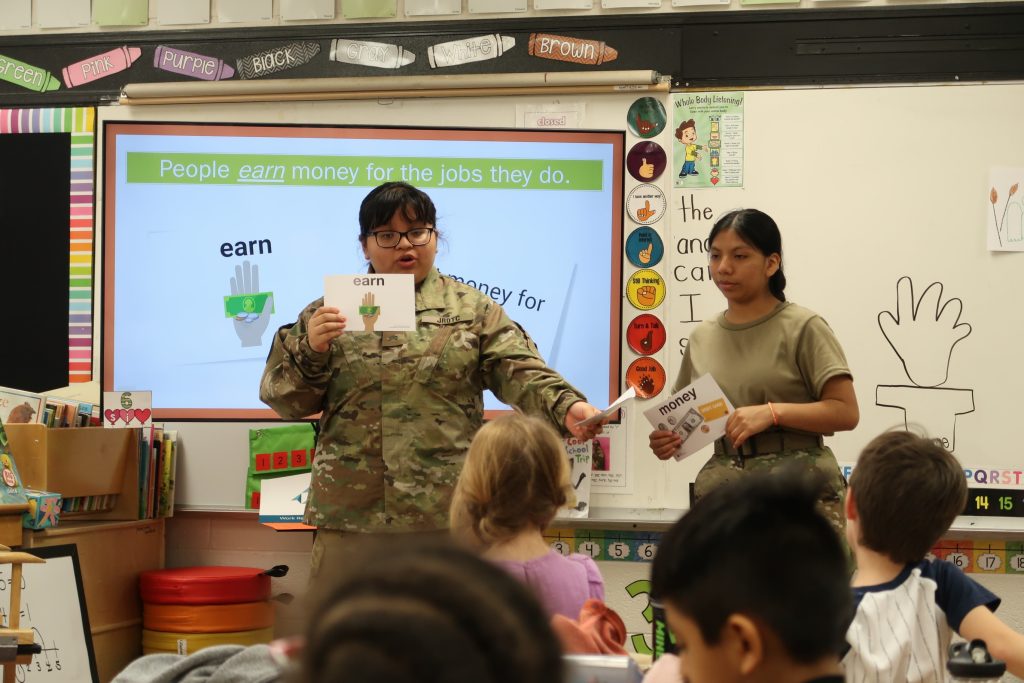Cadet Cecilia Lopez and Cadet Liseth Ramos teaching Junior Achievement