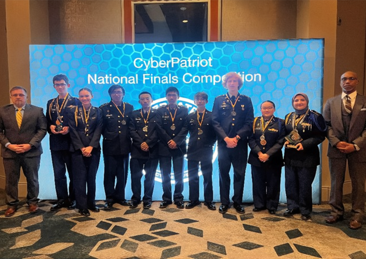 Lowell HS and Roosevelt High School with Mr. Nick Flowers and Mr. Rodney Tobias from USACC JROTC at the competition banquet.