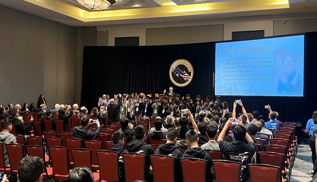 Teams take the competitor pledge before the competition