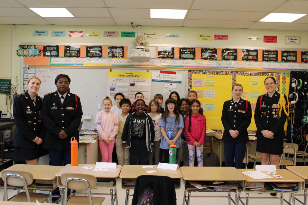 Cadets Brooklyn Swackhamer, Aniyah Henley , Devin Carr and Sophia Chiarello with their very motivated 3rd grade class.