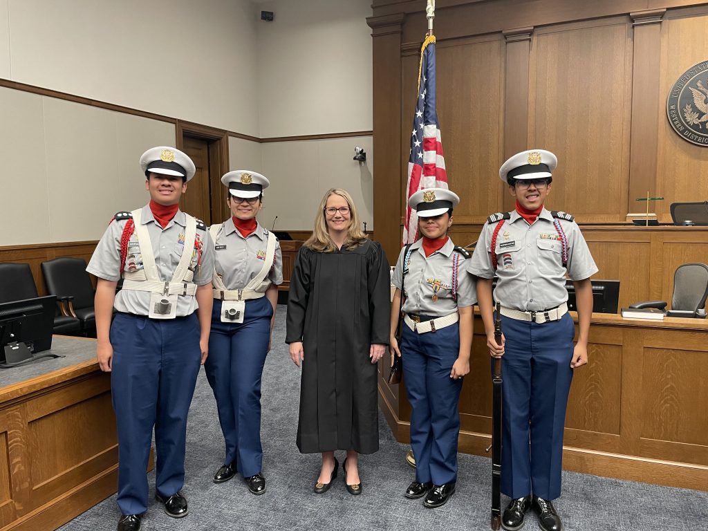 The Olympic High School JROTC Color Guard standing with the judge who performed the ceremony.