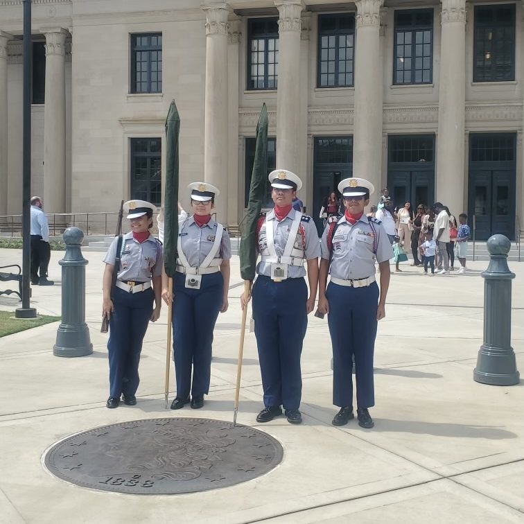 The Olympic High School JROTC Color Guard standing before the courthouse