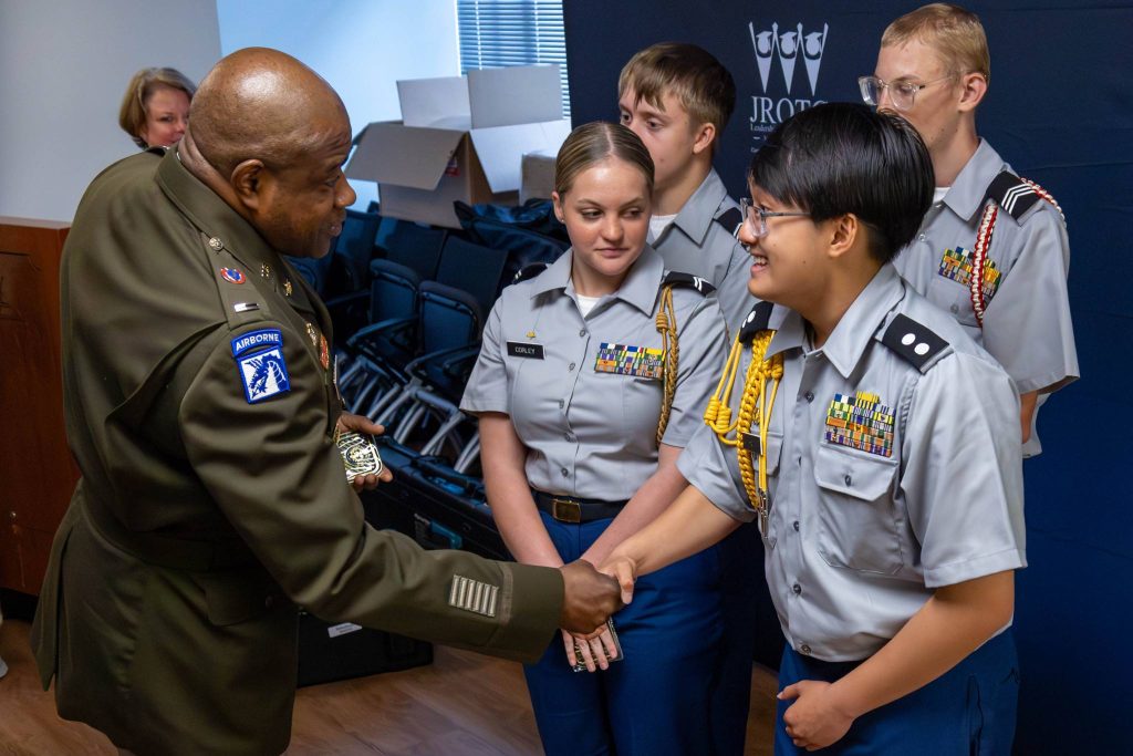 Chief Warrant Officer 5 LaShon White, Command Chief Warrant Officer of the U.S. Army Reserve, congratulates the Gadsden City High School Army JROTC Academic Team on winning the 2024 Joint Service Academic Bowl Championship on June 23 in Washington. White spoke to each of the cadets and presented them with a challenge coin. After two days of competition, the top JROTC teams representing the Army, Navy, Air Force, and Marine Corps met on a national stage to determine a champion in a Jeopardy-style competition