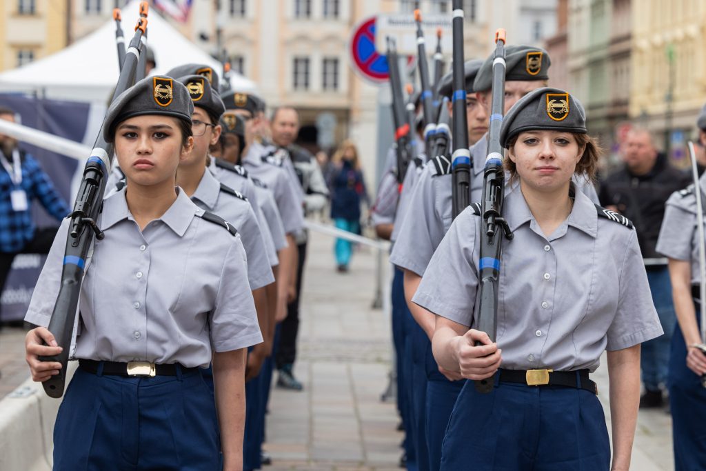 Names: (Front row L to R) Cdt/PVT Eva Saunders and Cdt/SFC Jazlyn Symak
Photo Credit: City of Pilsen
Caption: Ansbach JROTC Cadets perform drill routine at Republic Square, Pilsen, Czech Republic