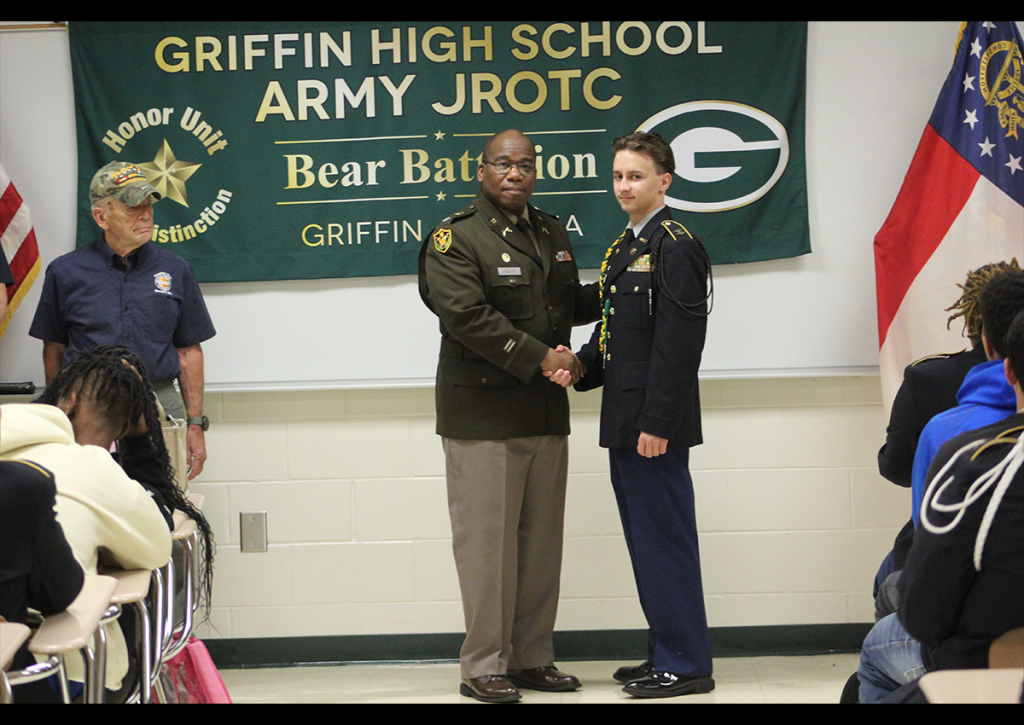 Retired Lt. Col Nathaniel Flegler Jr., the Senior Army Instructor of Griffin High’s JROTC program, congratulates Cadet Landon Rogers on being named the Vietnam Veterans of America Georgia State Council’s top cadet in the state.