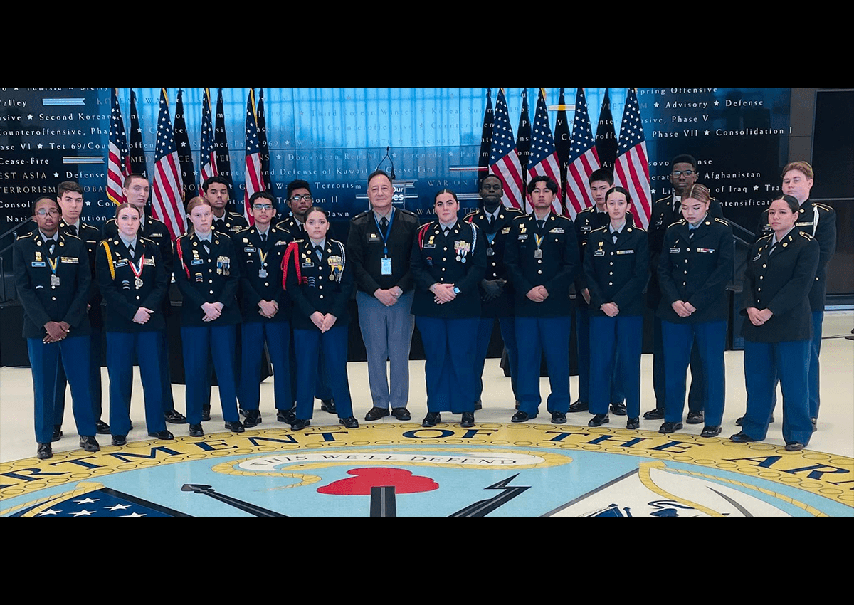 Viking Battalion Cadets gather around the emblem of the US Army at the Army Center of Military History.