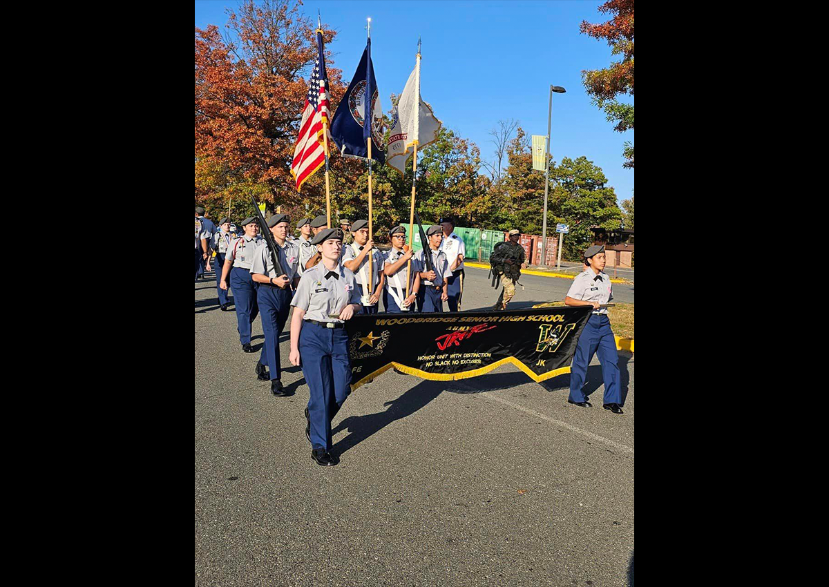 Cadets march to the sound of the Cadence Caller leading them through the Homecoming Parade.