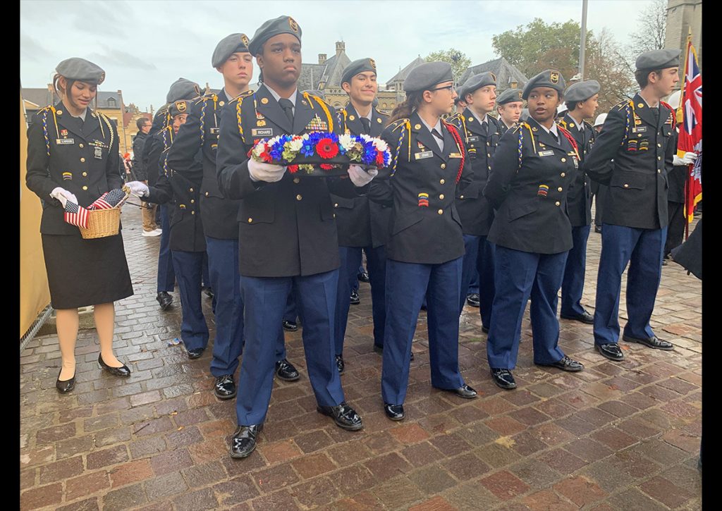 Photo Name: AnsbachVDT13 Names: MAJ (Ret) Madonna Roberts Photo Credit: MAJ (Ret) Madonna Roberts Caption: 9th JROTC Battalion Cadets prepare for the Poppy Parade in Ypres, Belgium