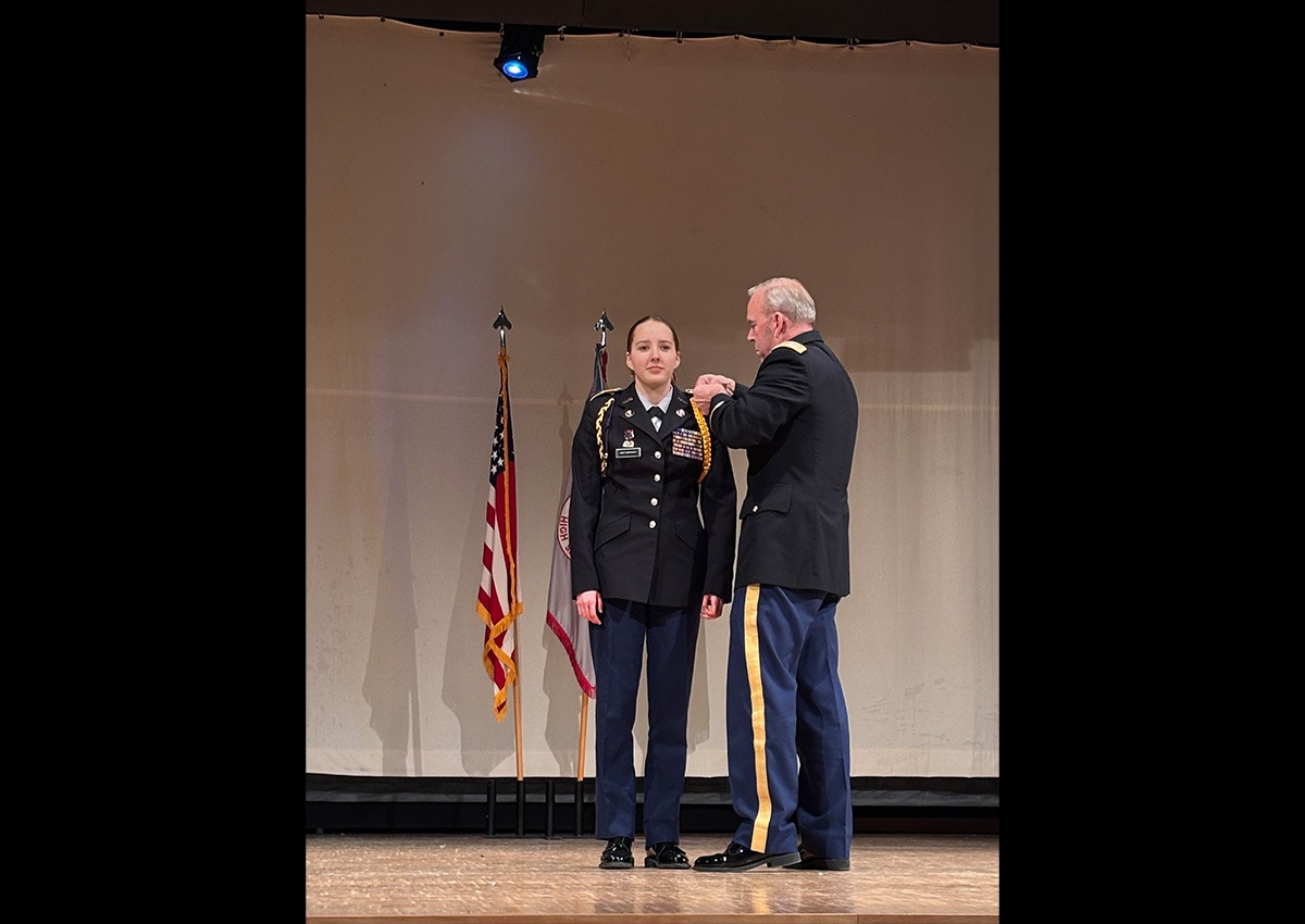 SAI LTC John Ring putting new ranks on Cadet CTP Avah Wetherwax during her promotion. (Photo taken by Cadet Anna-Victoria Westcott).