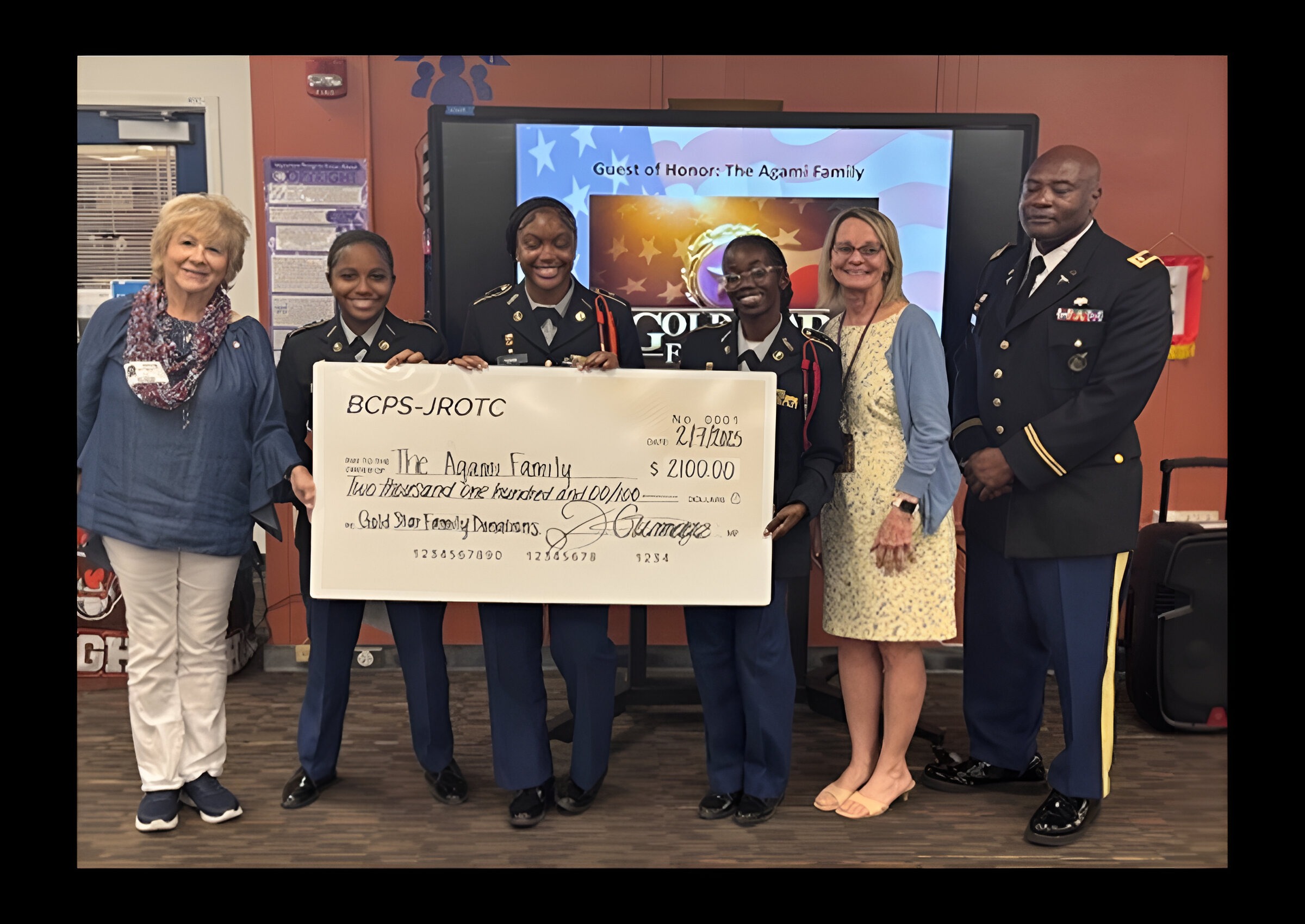 Pictured below from left to right: Ms. Beth-Becker Agami, Gold Star Mother, Tierston Porter, Battalion XO, Makensia Pierre, Service Learning Team Member, Nazari Dixon, Battalion S5, Ms. Marie Hautigan, Principal, and LTC Dexter Gammage, Senior Army Instructor