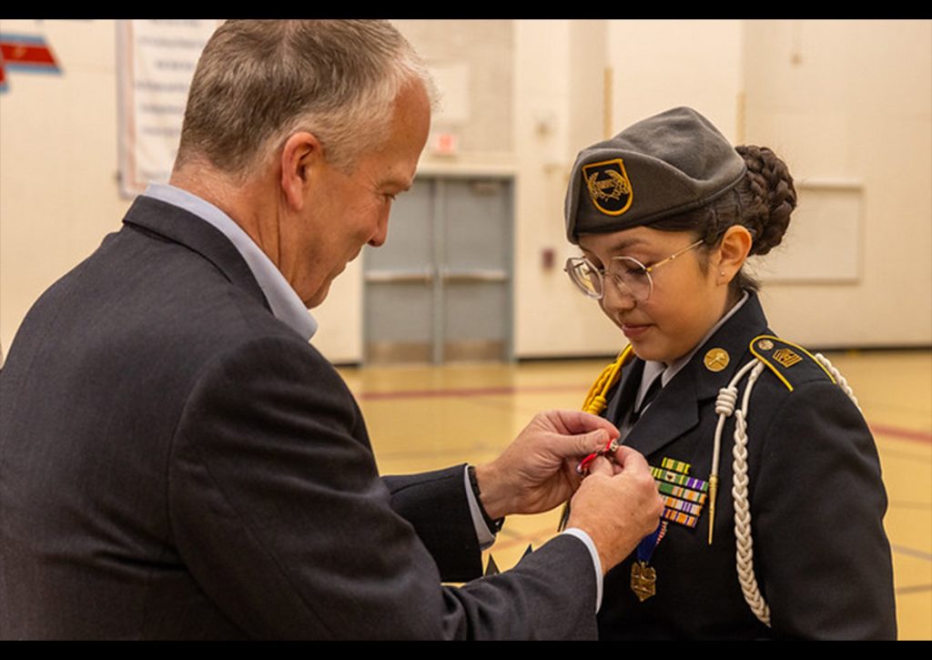 The Senator Pinning the LOV on the Cadet