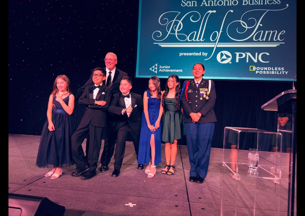c/LTC Huerta posing for a picture with kid presenters and the MC for the night at the Junior Achievement SA Business Hall of Fame Fundraiser dinner on March 18,2025.