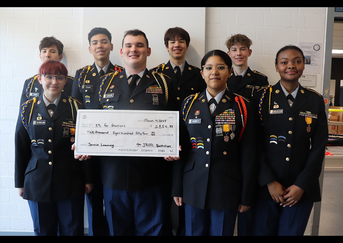Cadets of the 9th JROTC Battalion pose with donation check for K9s for Warriors.