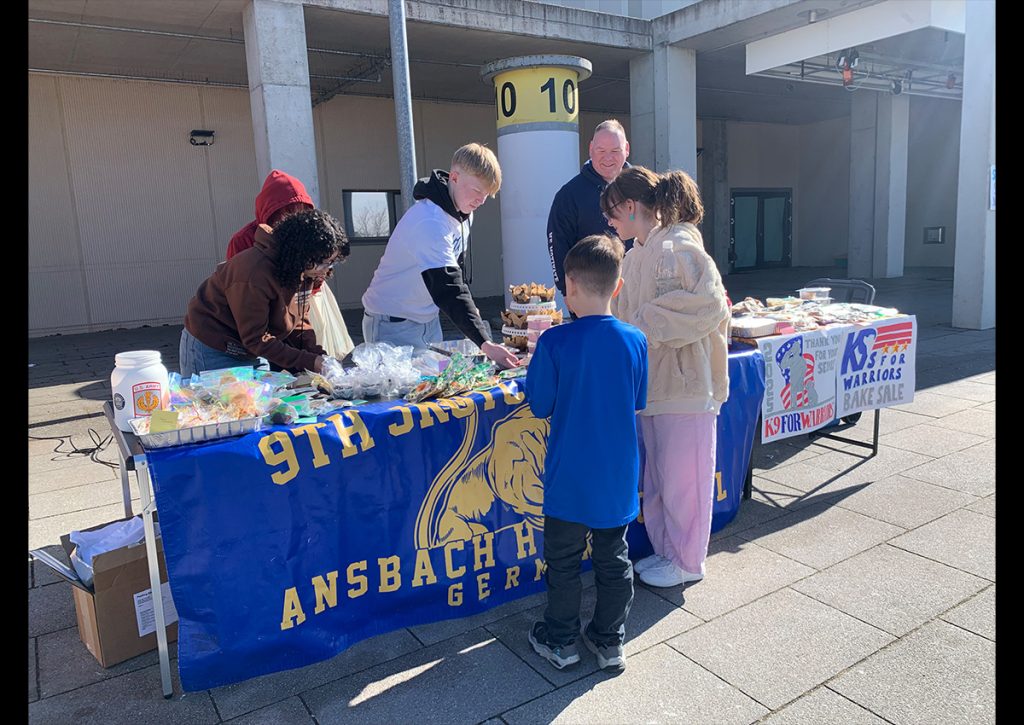 Left to Right: Cdt/MAJ Laysha Bobbitt, Cdt/CSM Lucas Hendrixson and MSG (Ret) Christopher Buchanan working at the bake sale.