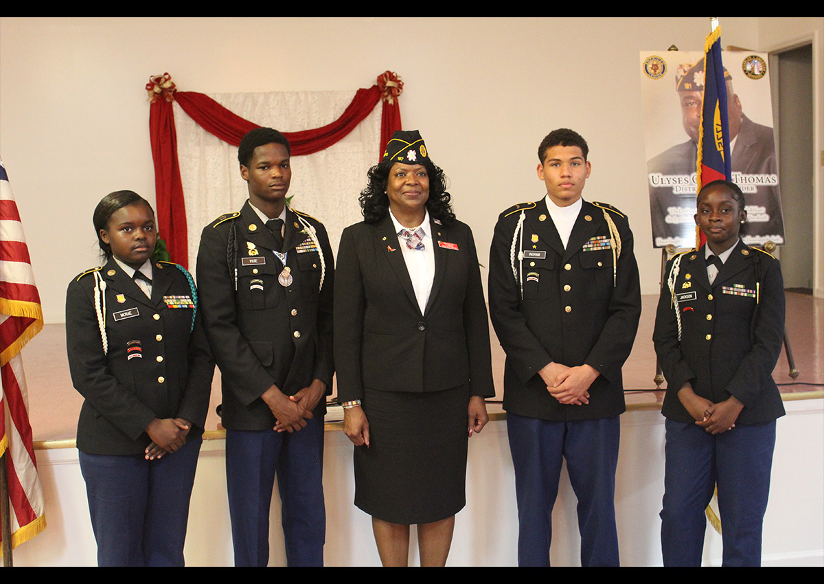 Scotland HS JROTC Color Guard is pictured with Army Veteran Patricia Harris, the Alternate National Executive Committeeman for the American Legion