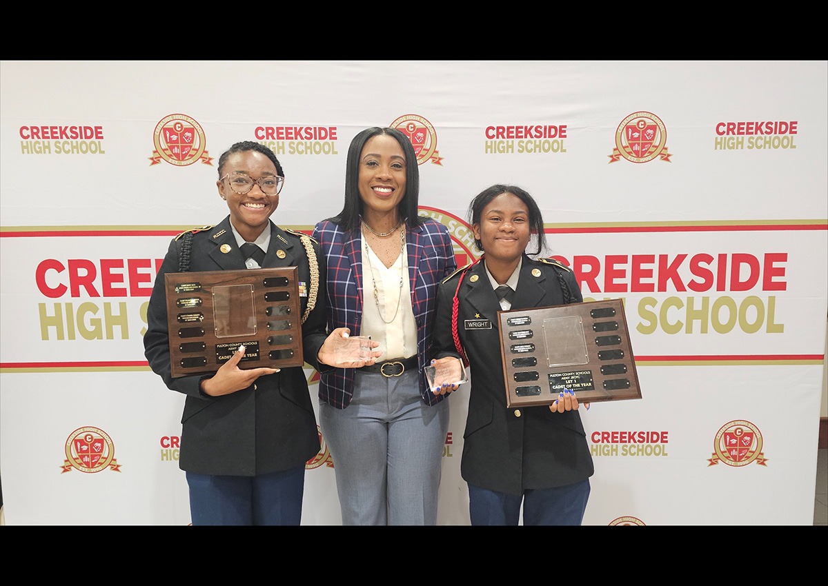 Dr. Terrell Awak, Creekside Principal, with c/1LT Jada Wright and c/MAJ D'Anna Curlett.