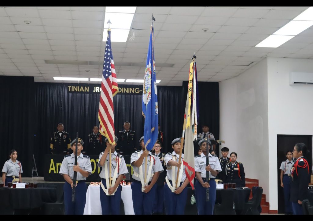 The Stallion Battalion color guard presents the flags.