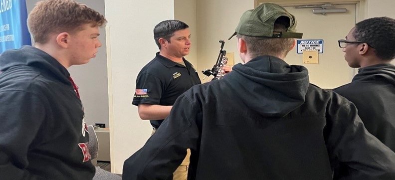 SSG Bahten from the Army Marksmanship Unit discusses marksmanship techniques and practices with Cadets.