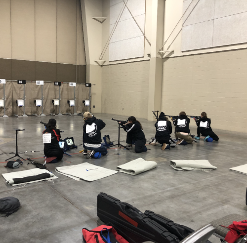 Denver South High Schoo, CO's Army JROTC team in kneeling position for Sporter